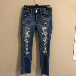 Medium-wash crop AE super super stretch jeans